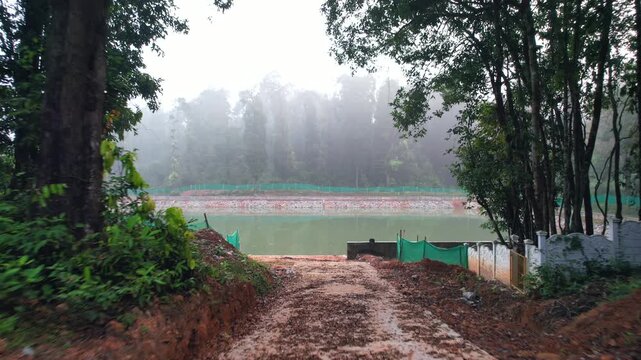 Madaga, Pond, Forest water pond, drone View
A sluice, floodgate, or canal, drain outlet used to let water flow out of a tank or reservoir.