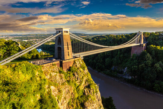 Clifton Suspension Bridge at Dramatic Golden Sunset over the River Avon in Bristol, England, UK