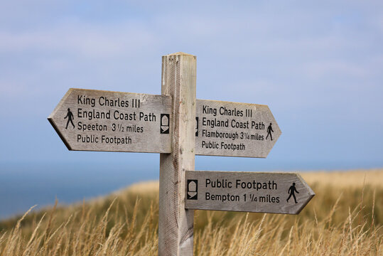 signpost on the coast, King Charles 111 public Coastal Path signpost,