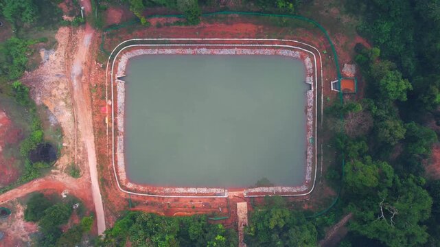 Madaga, Pond, Forest water pond, drone View
A sluice, floodgate, or canal, drain outlet used to let water flow out of a tank or reservoir.