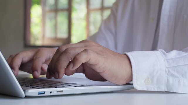 Close Up of Professional Typing on Laptop at Home Office, Remote Work, Digital Productivity, Business Communication, Online Collaboration, Modern Workspace, Flexible Working Lifestyle, Green natural