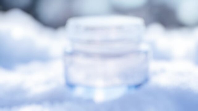 A water bottle sits atop a pile of snow, perfect for use in winter scenes or as a symbol of refreshment