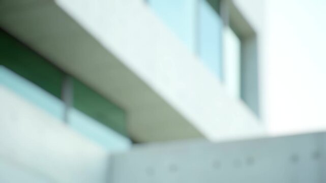 A close-up view of a stop sign located near a building, great for use in urban or city-themed projects