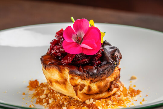 Burnt Basque Cheesecake with Cherry Compote and Edible Flower