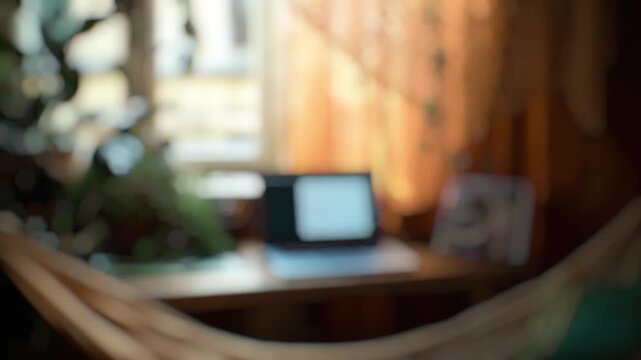 A blurred  of a laptop on a desk, suitable for use in presentations or articles about technology
