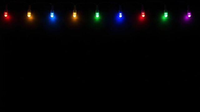 Colorful led christmas lights string on black background