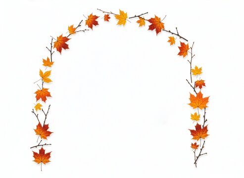 Colorful autumn maple leaves and twigs arranged in an arch shape on a white background.

