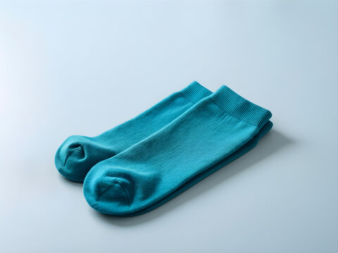 Pair of neatly folded plain compression socks with distinct cuffs