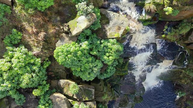 Aerial drone footage of a tall rocky waterfall in the Yorkshire Dales, Pennies. Moorland scene of a majestic waterfalls near Marsden West Yorkshire. Huddersfield Outdoors