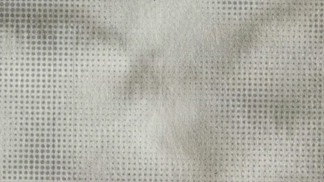 Vintage halftone dot background featuring dark ink bleeding into textured paper with film grain, dust, fine line overlays, and dynamic brightness flicker