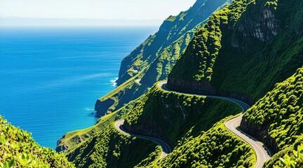 Obraz premium Winding mountain road snakes along steep green cliff side above deep blue ocean water. Scenic coastal highway runs through rich tropical island hills. Summer travel route offers stunning panorama for