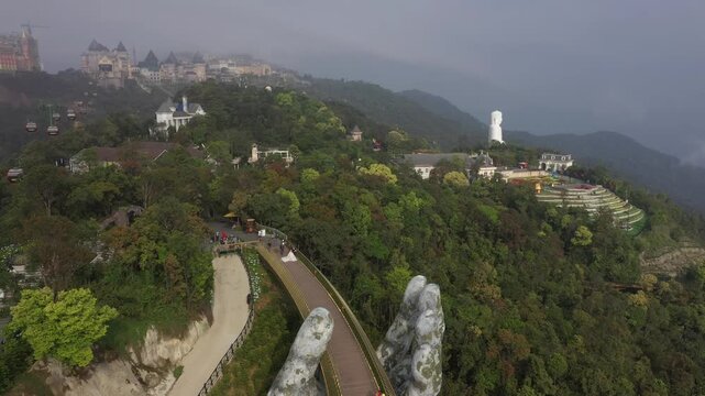 B&agrave; N&agrave; Hills Resort Aerial View: Golden Bridge, Giant Buddha Statue, French Village & Panoramic Da Nang Cityscape, Vietnam