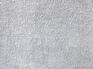 Fototapeta premium Close up of a light gray concrete wall with fine rough texture, ideal as an abstract architectural background.