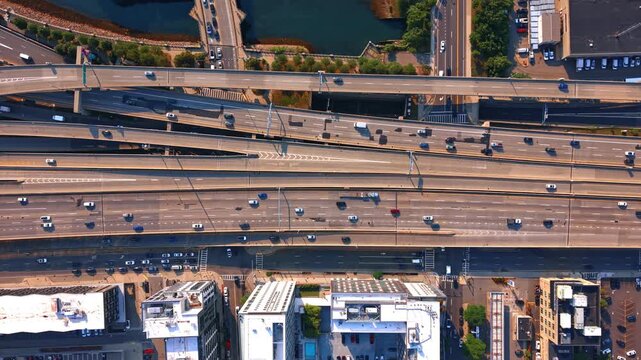 Lively traffic on the multi-lane roads of Boston, Massachusetts, USA. Top view on the city motorways at daytime.