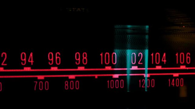 Vintage radio frequency tuner display with colorful glitch effects. Retro audio receiver scale dial background for music, broadcast, podcast, old tech, nostaglic vibe, media production.