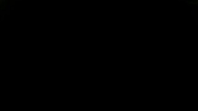 Bright green electric lightning arcs framing the corners on a solid black background surface