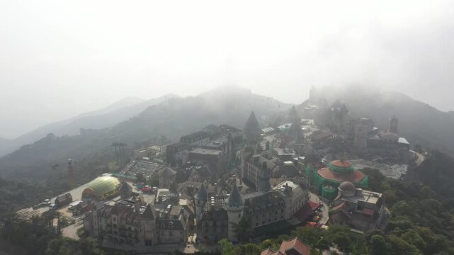B&agrave; N&agrave; Hills Resort Aerial View: Golden Bridge, Giant Buddha Statue, French Village & Panoramic Da Nang Cityscape, Vietnam