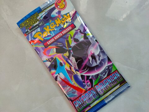 Malang, Indonesia - July 21, 2026: A Pok&eacute;mon Trading Card Game "Ancaman Bayangan" (Shadow Threat) booster pack from the "Evolusi Mega" (Mega Evolution) set. 