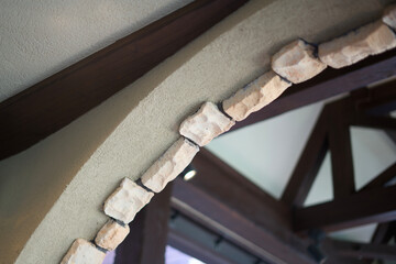 Textured Stone Corbels Along Building Eave Edge © Kosuke Miyoshi