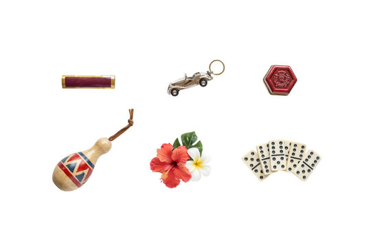 Collection of traditional accessories game pieces and tropical hibiscus flowers isolated on white background