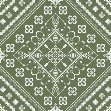 Seamless geometric medallion pattern with pixel-style floral, diamond, and botanical motifs arranged in a symmetrical repeating layout on an olive green background. Suitable for fabric, wallpaper, and