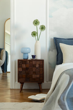 Cozy Bedroom Scene with Wooden Nightstand and Modern Decor Elements for Peaceful Home Interior