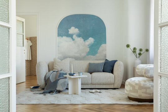 Minimalist Living Room with Cloud Mural and Cozy Furniture