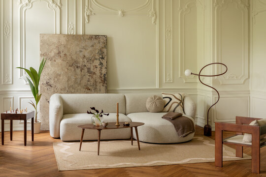 Elegant and Modern Living Room with Stylish Furniture and Ornate Wall Details