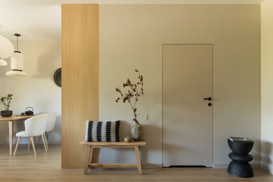 Minimalist Home Interior with Wooden Bench and Neutral Decor