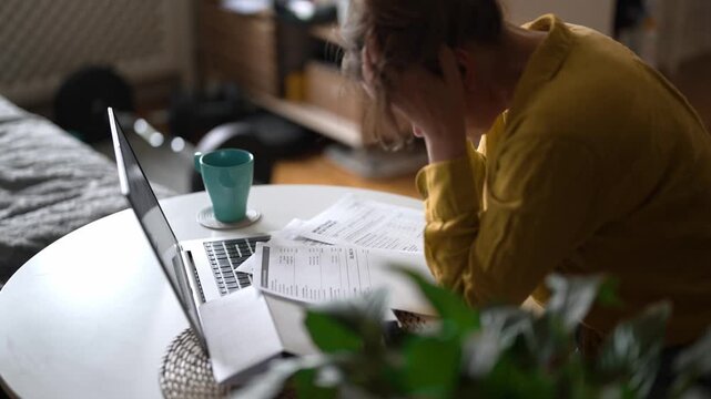 Stressed woman having financial problems with paying bills.