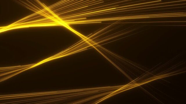 Slow motion tracking shot of golden light streaks crossing and intersecting on dark digital abstract background seen as luminous lines and particle trails flowing across frame