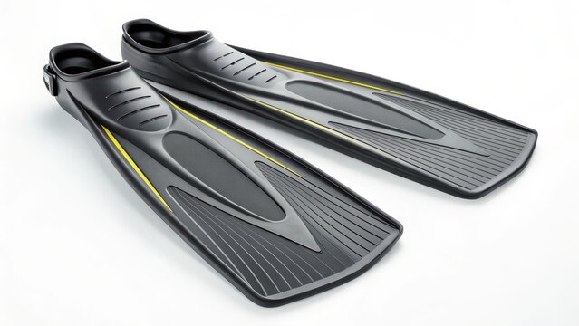 A pair of black and yellow diving fins lie on a white surface. These fins are designed for swimming and water sports, offering propulsion and efficiency in the water.