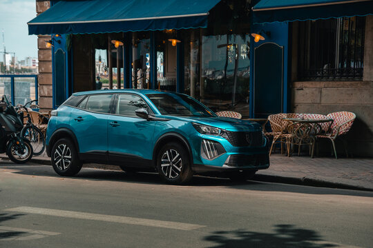 Peugeot 2008 new SUV electric EV family car parked in a street setting