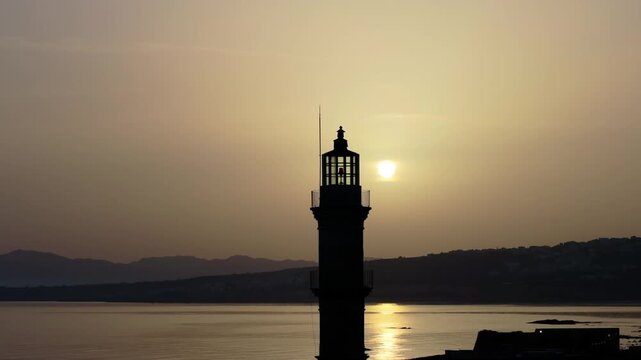 View of Chania with the amazing lighthouse, mosque, venetian shipyards, Crete, Greece.Waves crashing on lighthouse, Beautiful Greece and best scenic places - panorama