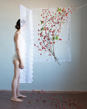 Anonymous woman standing behind the veil