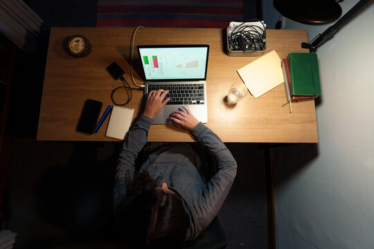 Woman Working Late on Laptop