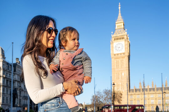 Mother And Toddler Admiring Big Ben During Family Vacation