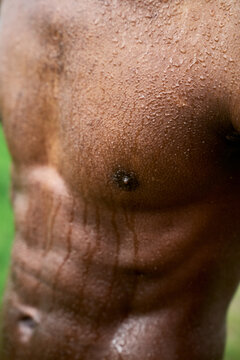 Muscular Man With Wet Skin After Workout in Gym