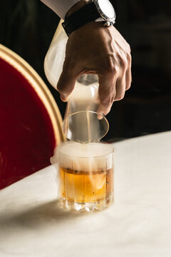 Pouring a cocktail