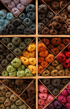 Collection of wool skeins exposed in a knitting shop.
