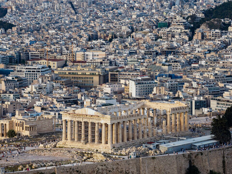 Parthenon temple overlooking sprawling athens city panorama
