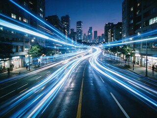 Fototapeta premium High-angle view of a busy intersection at night, showing light trails from moving vehicles creating a vibrant, futuristic cityscape. 