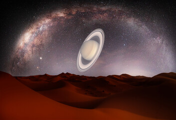 Amazing Milky Way over the sand dunes of Sahara Desert with Saturn planet - Sahara, Morocco "Elements of this image furnished by NASA" © muratart