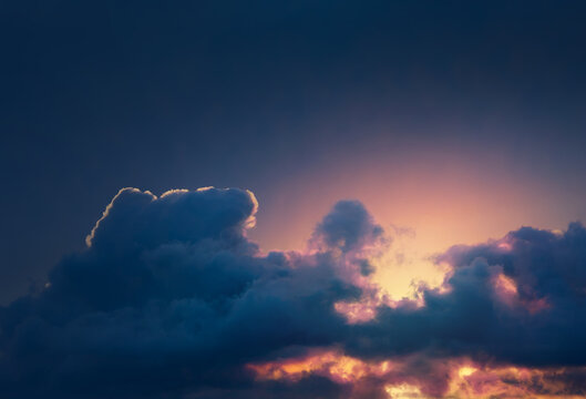 Dramatic sky with clouds at sunset, colorful evening cloudscape background