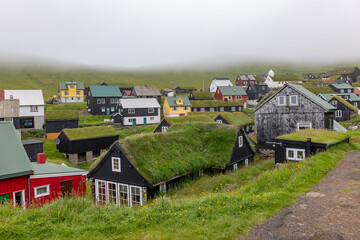 Fototapeta premium Colorful Grass-Roofed Village on Faroe Islands Hillside