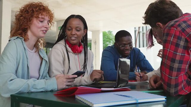 Diverse university students studying together on campus