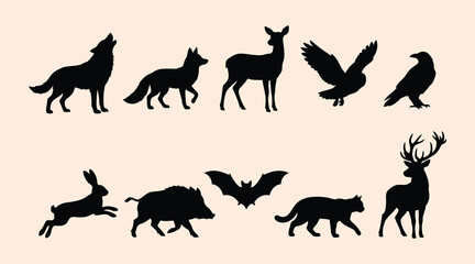 Collection of black silhouette illustrations of various wild and domestic animals including a wolf howling fox deer owl eagle rabbit wild boar bat cat and a stag isolated on a lightcolored background  © Be Creative