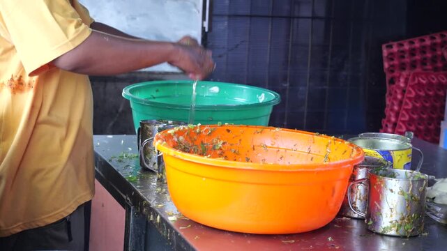 Food Vendor Mixing Egg and Beef Filling for Traditional Martabak Telor Kubang
