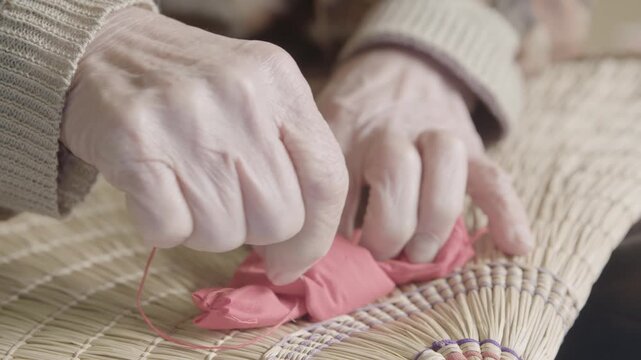 Hands Stitching Fabric on Straw for Bon Odori Hat Craft in Ugo Town Ak
