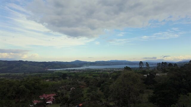 panoramic view of calima lake and mountains at sunset